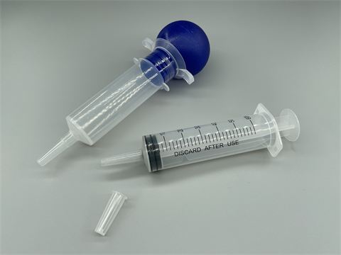 Syringe irrigator
